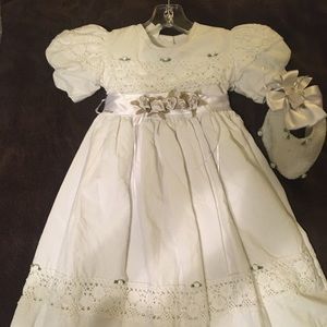 White baby dress with crocheted detail and bonnet